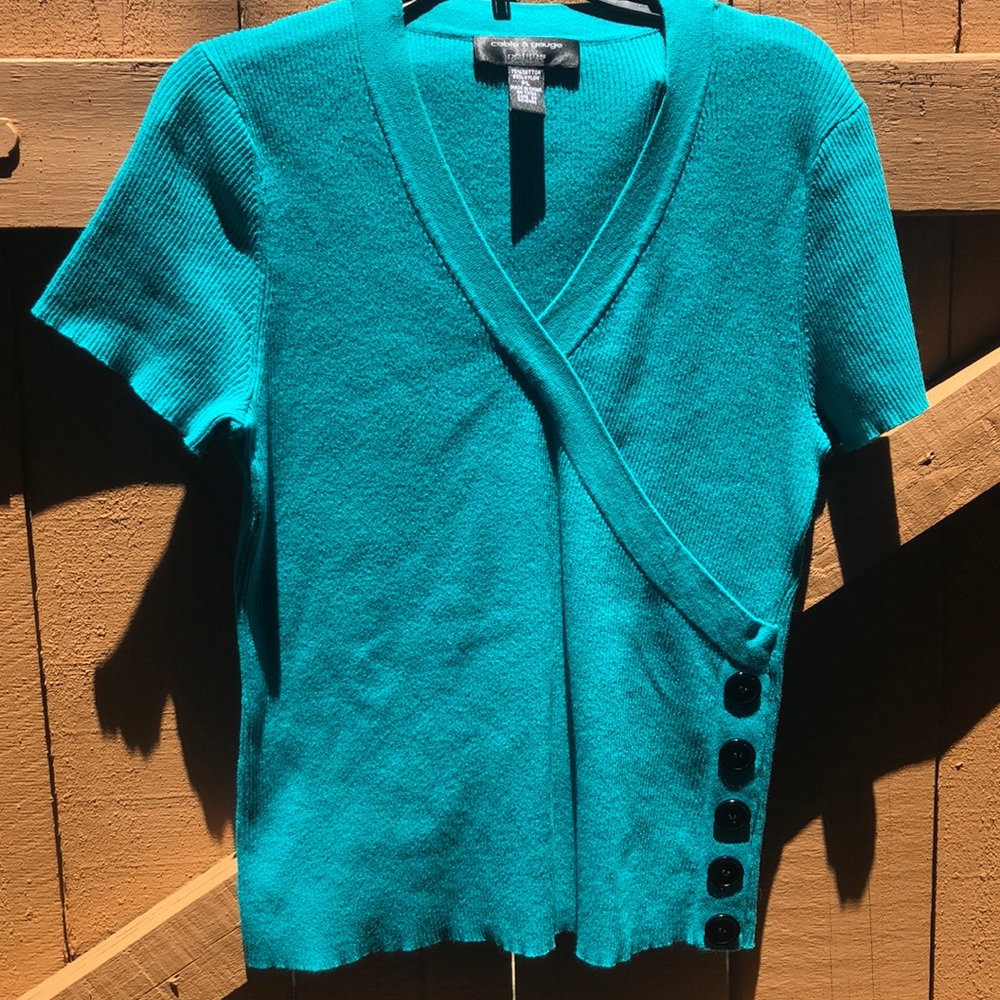 Green sweater top with black buttons
